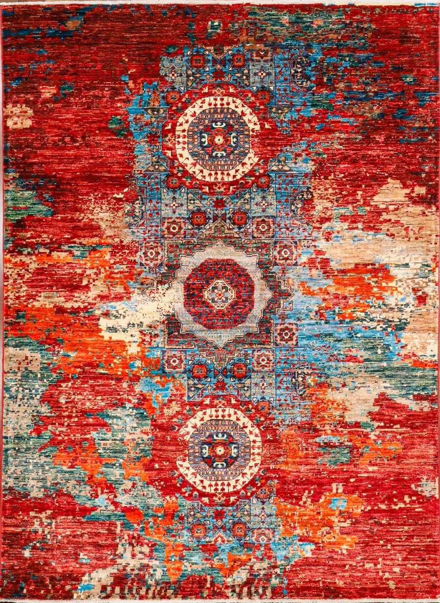 Modern Handmade rug based on Mameluk pattern in bright reds, blues, and orange tones. Hand-knotted in wool and made in Pakistan. 