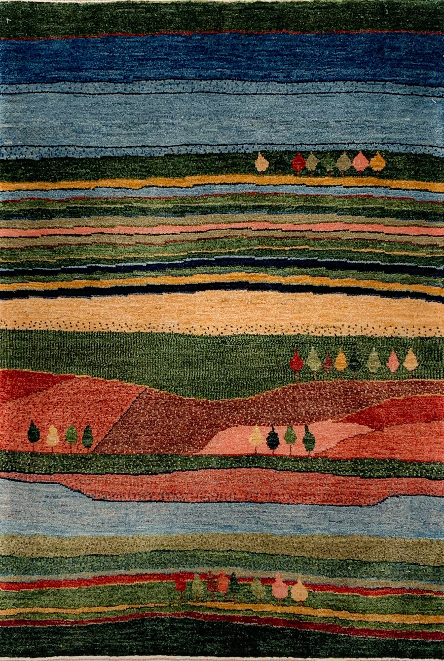 Landscape Scene 3x5 Gabbeh depicting a scene of rolling hills, a river, and several trees.