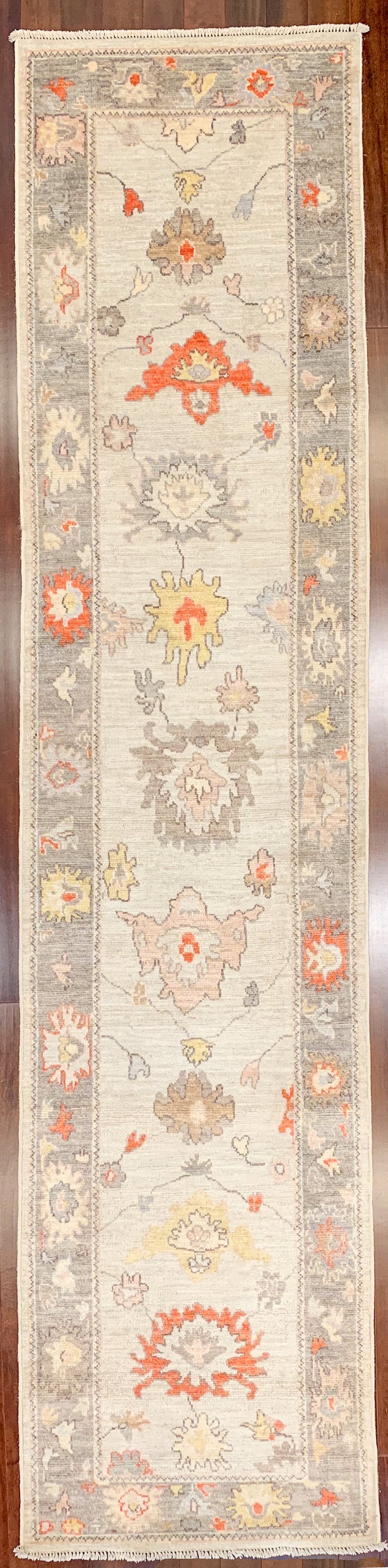 Oushak or Ushak style hall runner rug using pastel blue, red, golden yellow, and purple grey colors