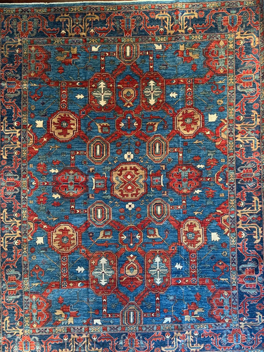 A traditional Bidjar pattern Persian rug in blue and red with a lattice type design.