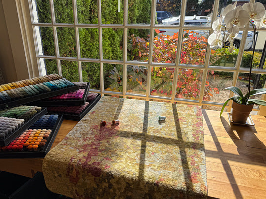Designing a custom rug using color poms to decide on color. 
