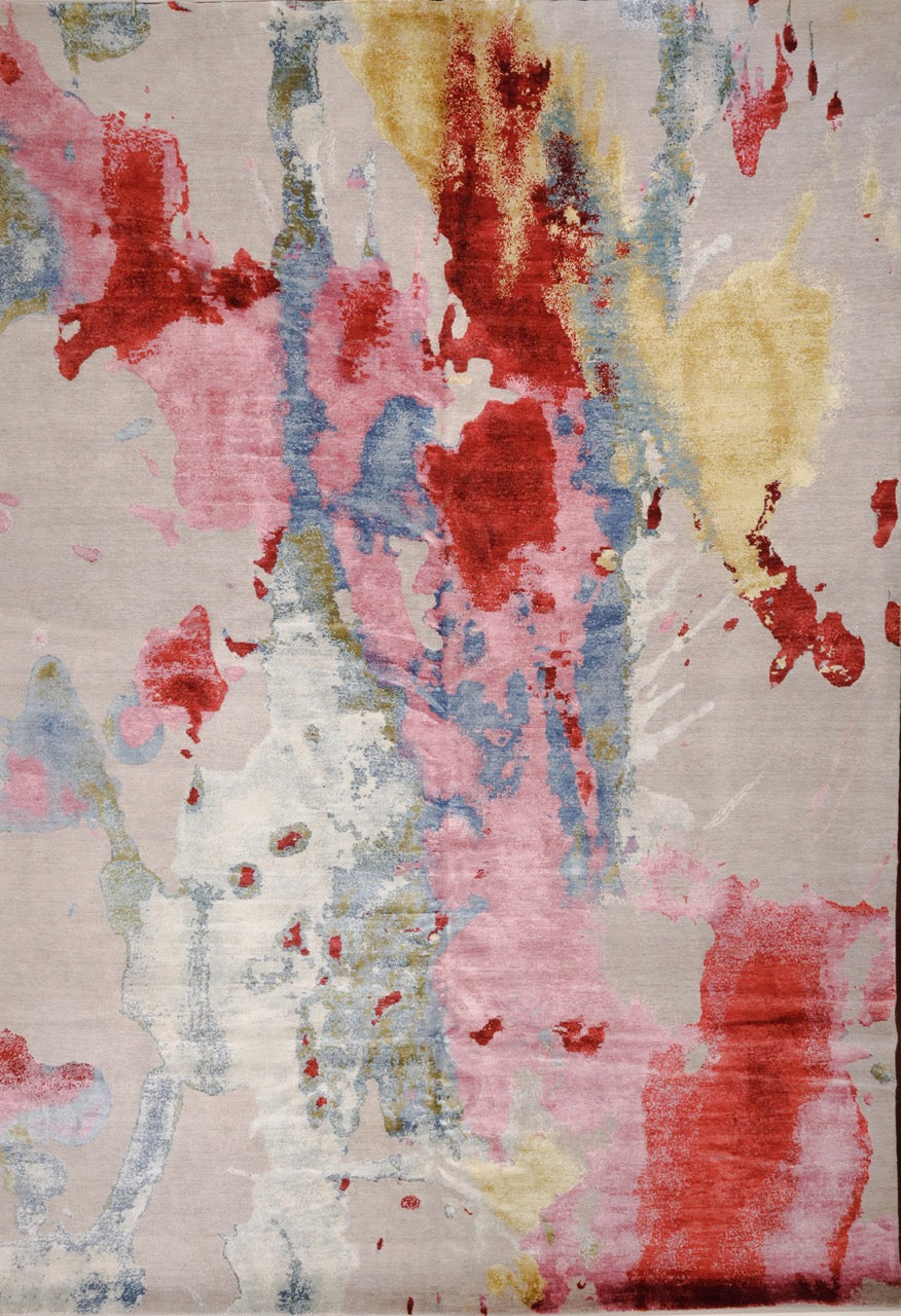 Splash No. 04 in Grey from Rug Star. This modern area rug measures 10x14 and has a Jackson Pollock style splash of yellow, pink, red, steel blue, and silver.