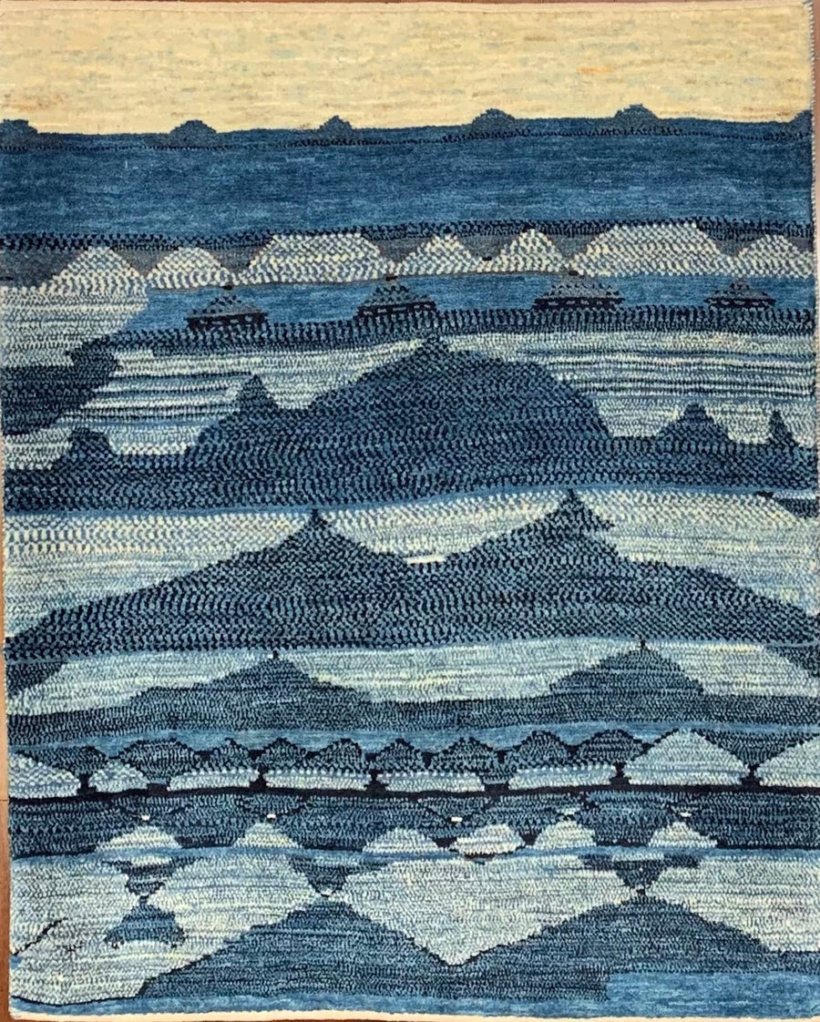 Handmade gabbeh rug with landscape of indigo dyed wool. 