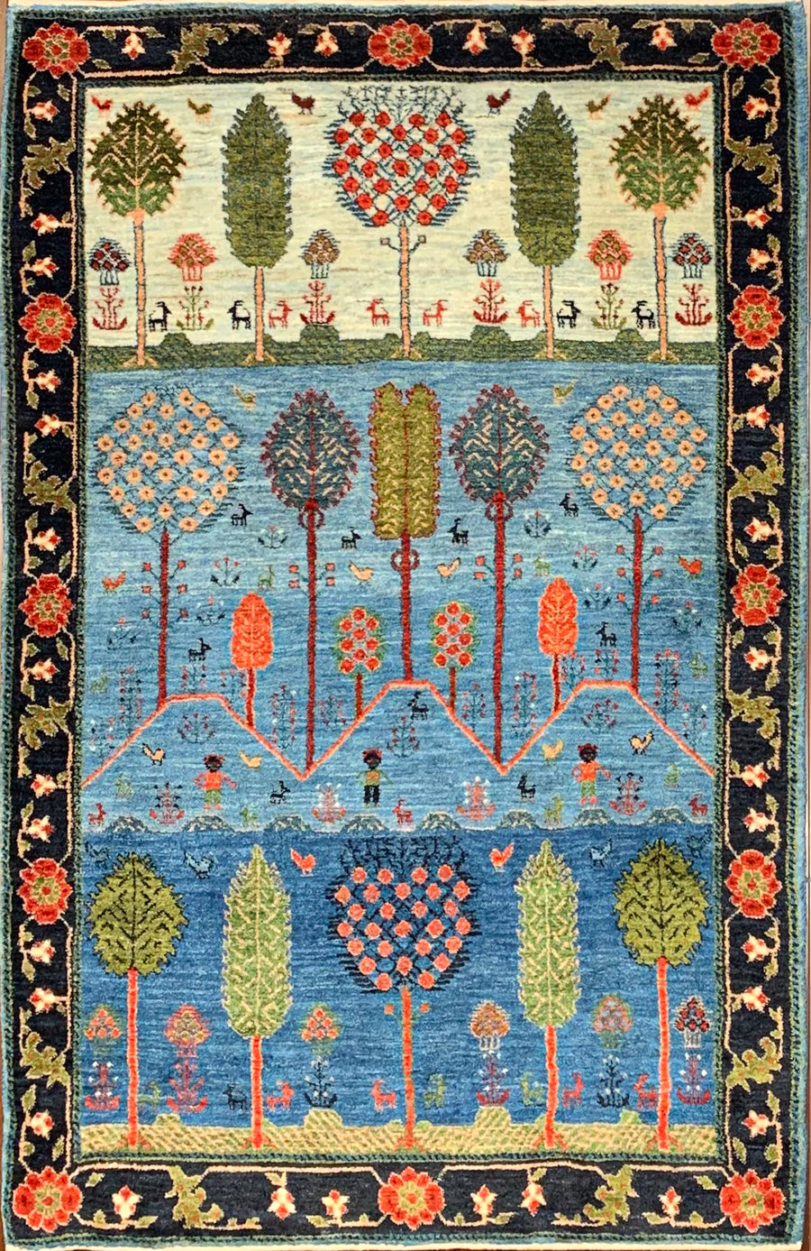 Traditional Handmade Gabbeh Luribaft rug with trees and hills.