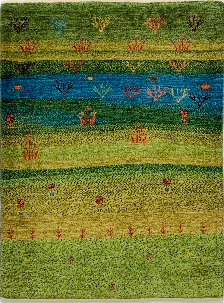 Wool Gabbeh depicting a scene of a river crossing a meadow. Handwoven in Southern Iran.