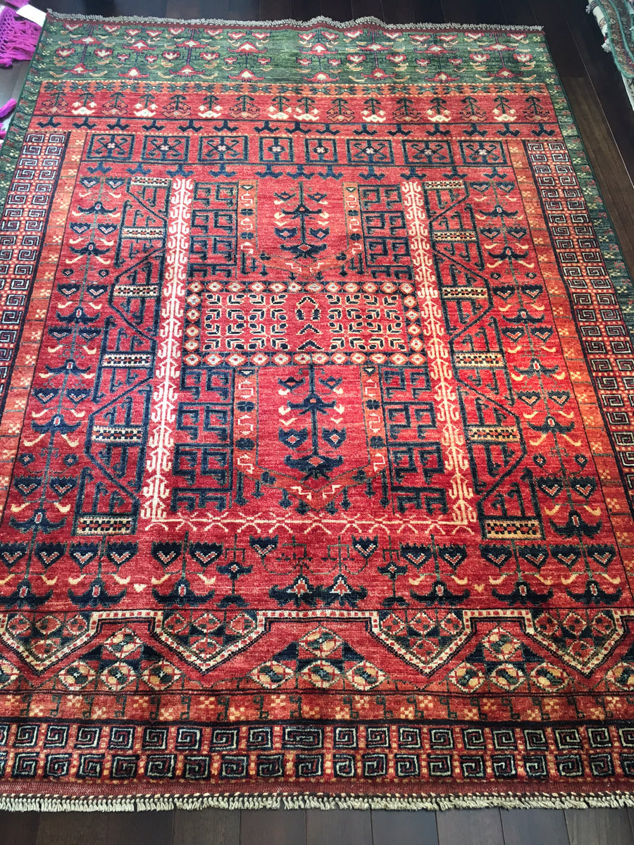 Ersari "Engsi" Carpet woven in Afghanistan with red, green, white, and dark navy blue. 