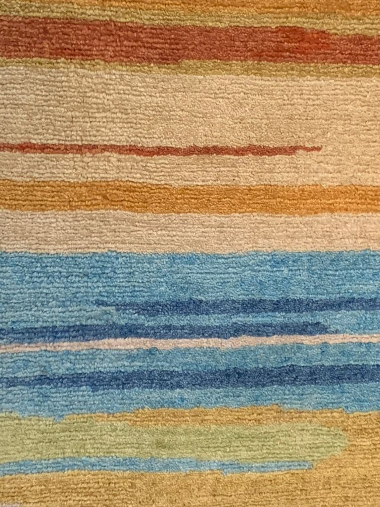 Close-up of Handmade Nepalese 9x12 Rug with colorful stripes