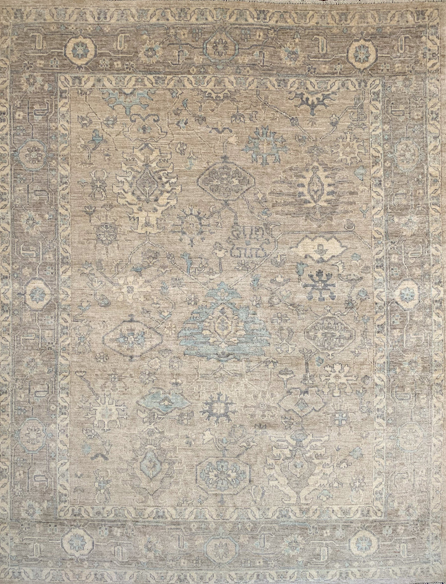 Modern oushak ushak with an intentionally faded pattern of traditional rug shapes in light blue and gray against a lighter gray background. 