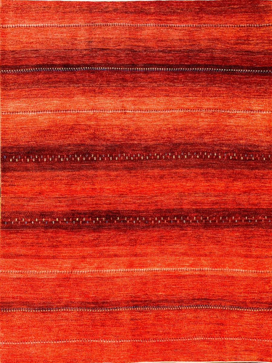 The Classic Red Tribal Gabbeh. Measures 9x12 and handmade in Southern Iran